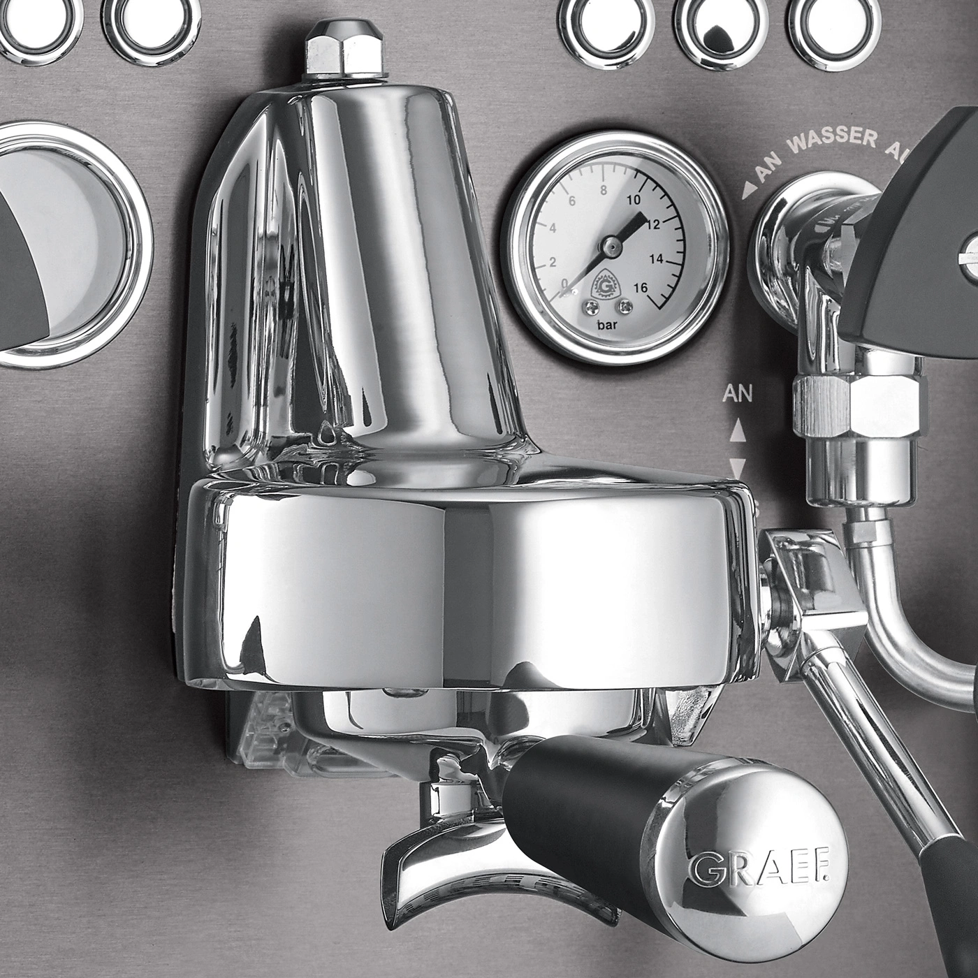 Close-up of a shiny espresso machine with a pressure gauge and GRAEF logo.