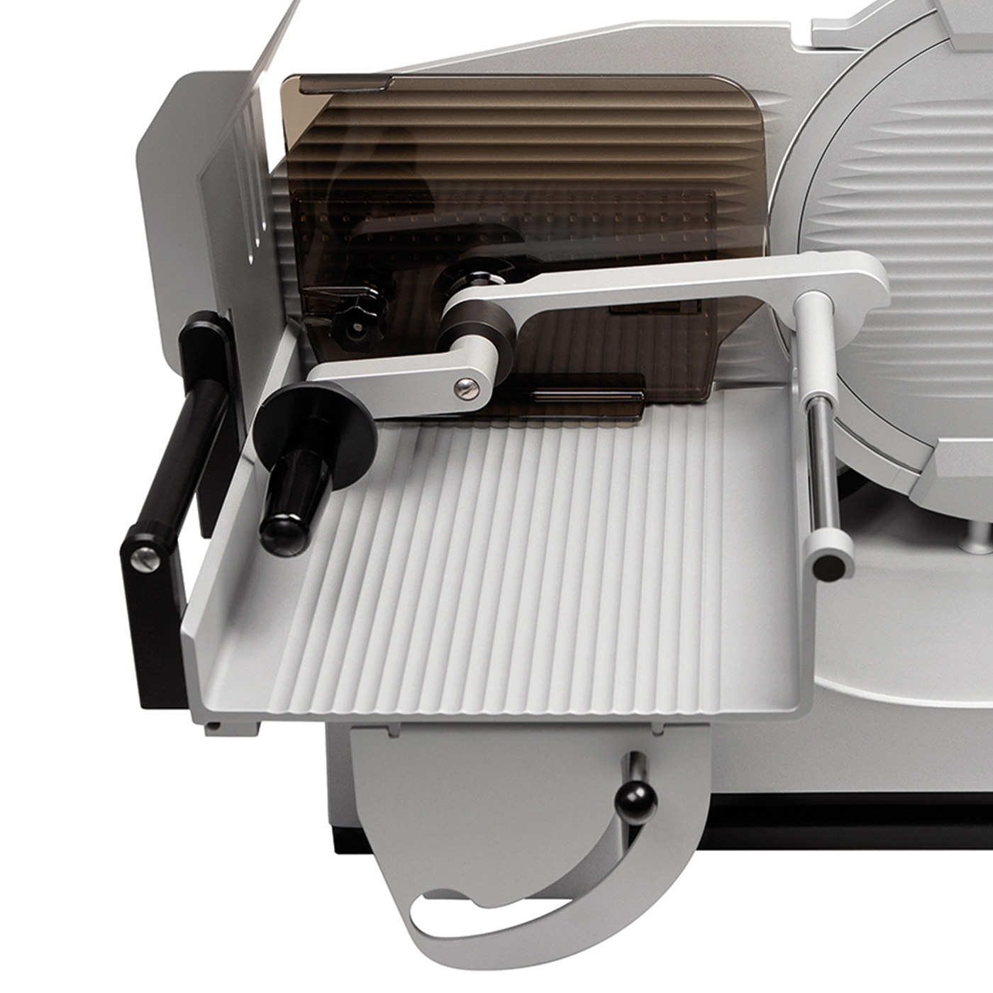 Meat slicer, silver, with guard, handle and blade, close-up, isolated on white