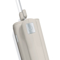 Close-up of a beige device with silver accents and a logo on a white background