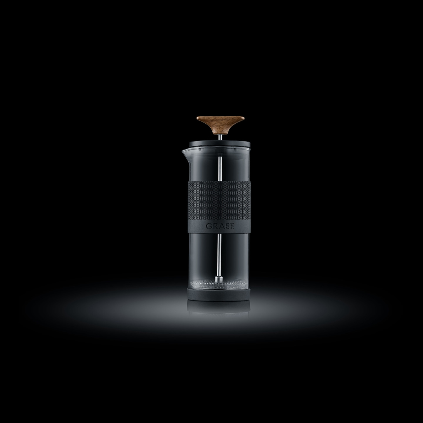 Coffee maker with wooden handle on black background, GRAEF logo