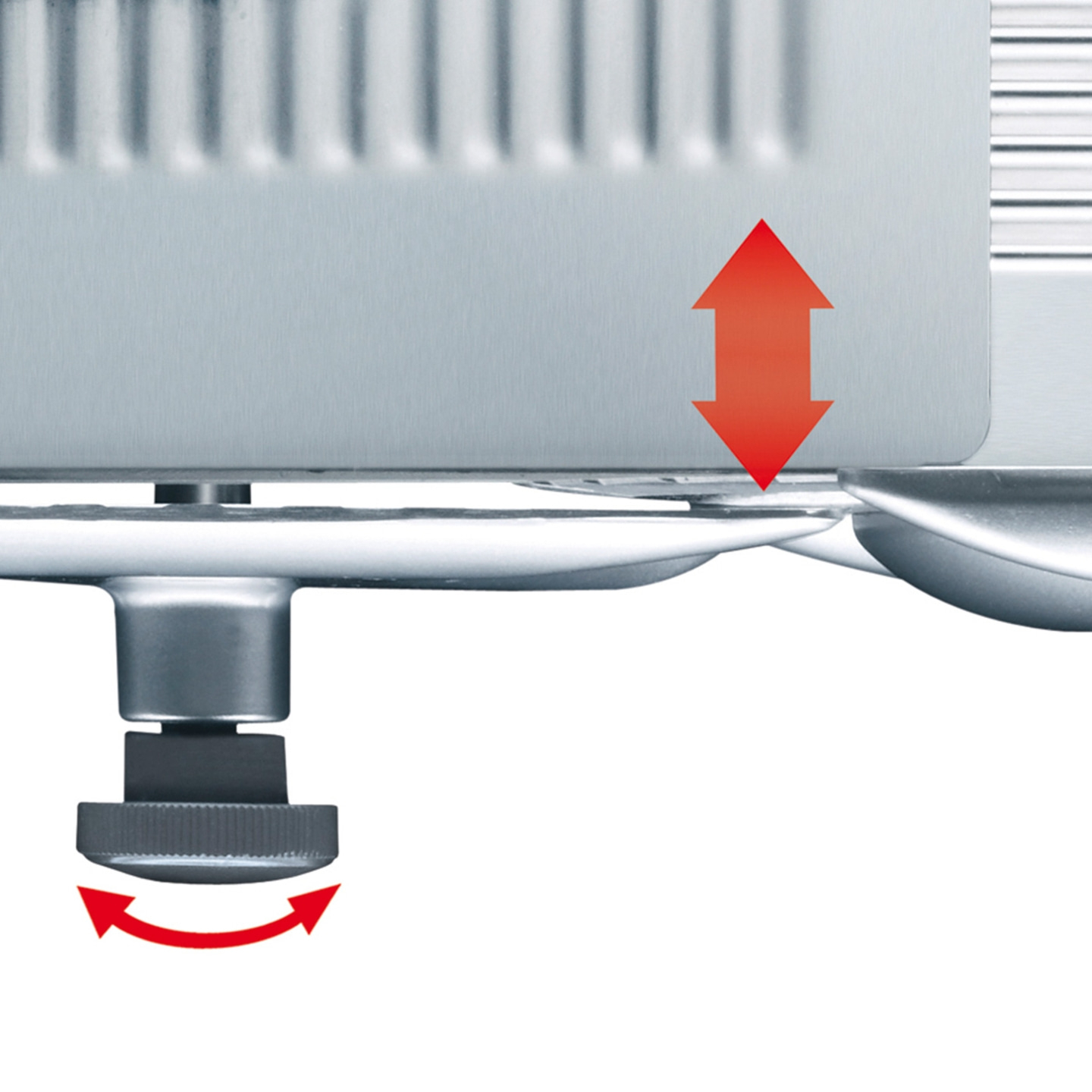Gros plan d'un appareil avec des flèches indiquant le réglage et la rotation.