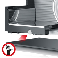 Affettatrice con freccia rossa e simbolo donna per rimuovere il vassoio.