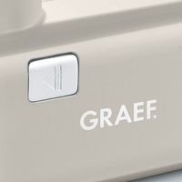 Graef appliance with play button and logo. Beige color, close-up detail.