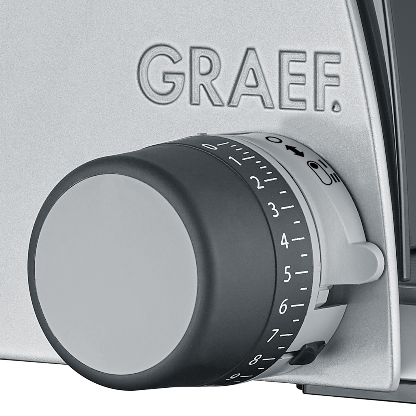 Close-up of a GRAEF device with a dial and numbers for adjusting the thickness.