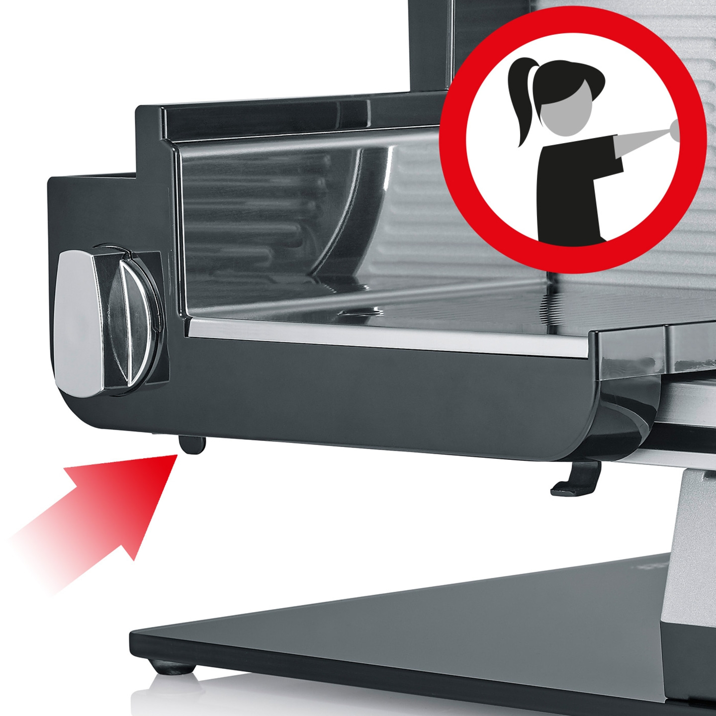Meat slicer with red arrow and warning symbol for safety instructions