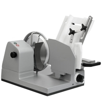 Gray electric food slicer with knobs and blades for slicing food products, kitchen appliance.