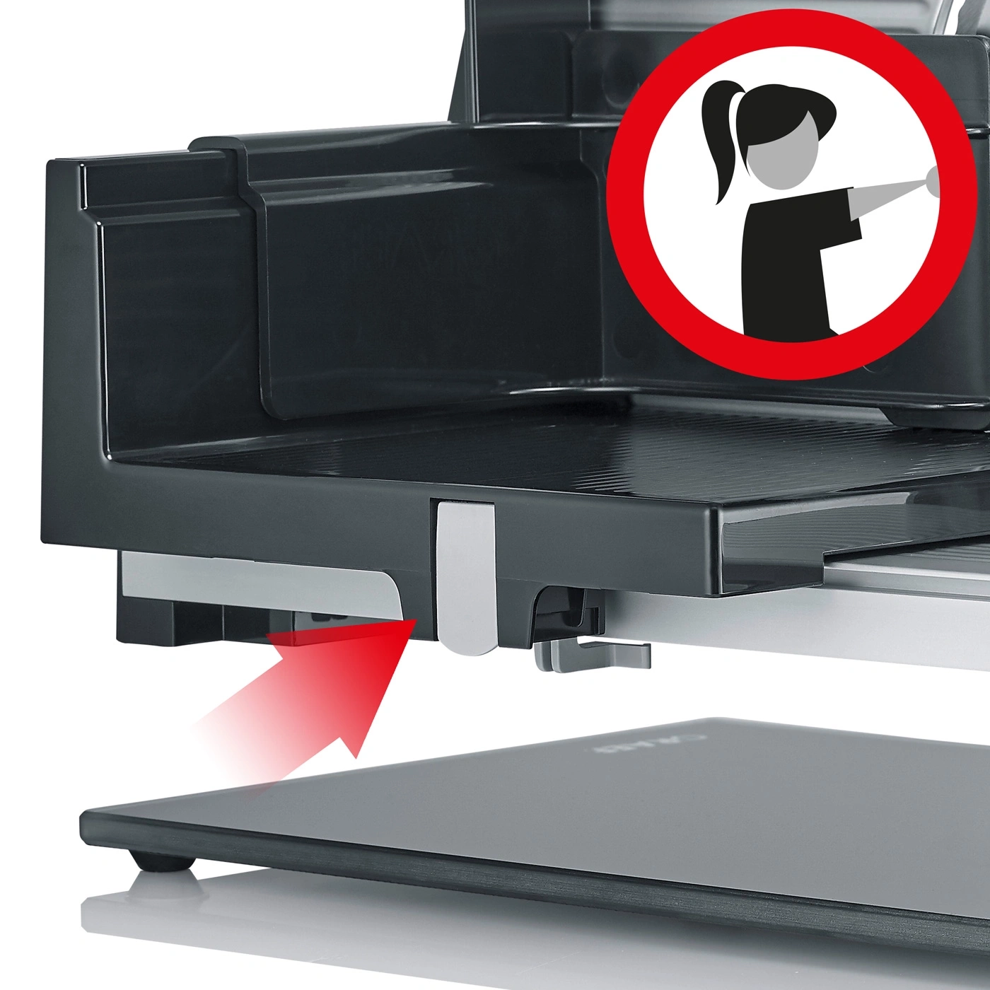 Meat slicer with red arrow and warning symbol for safety instructions
