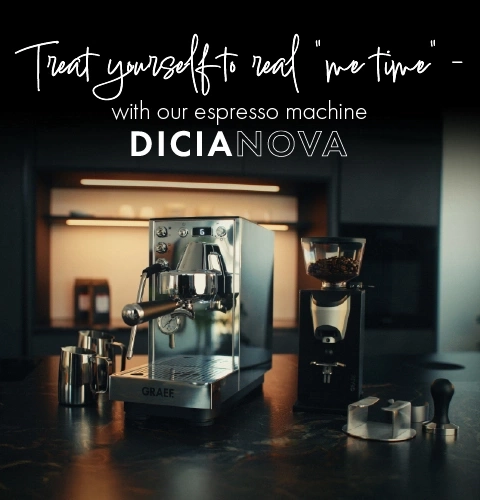 An espresso machine and coffee grinder on a marble countertop.