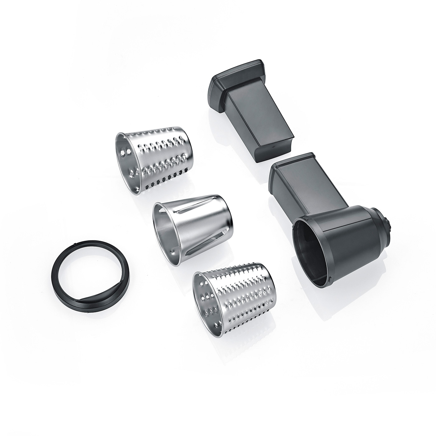 Grater attachments and parts on white background, kitchen utensils, food preparation.