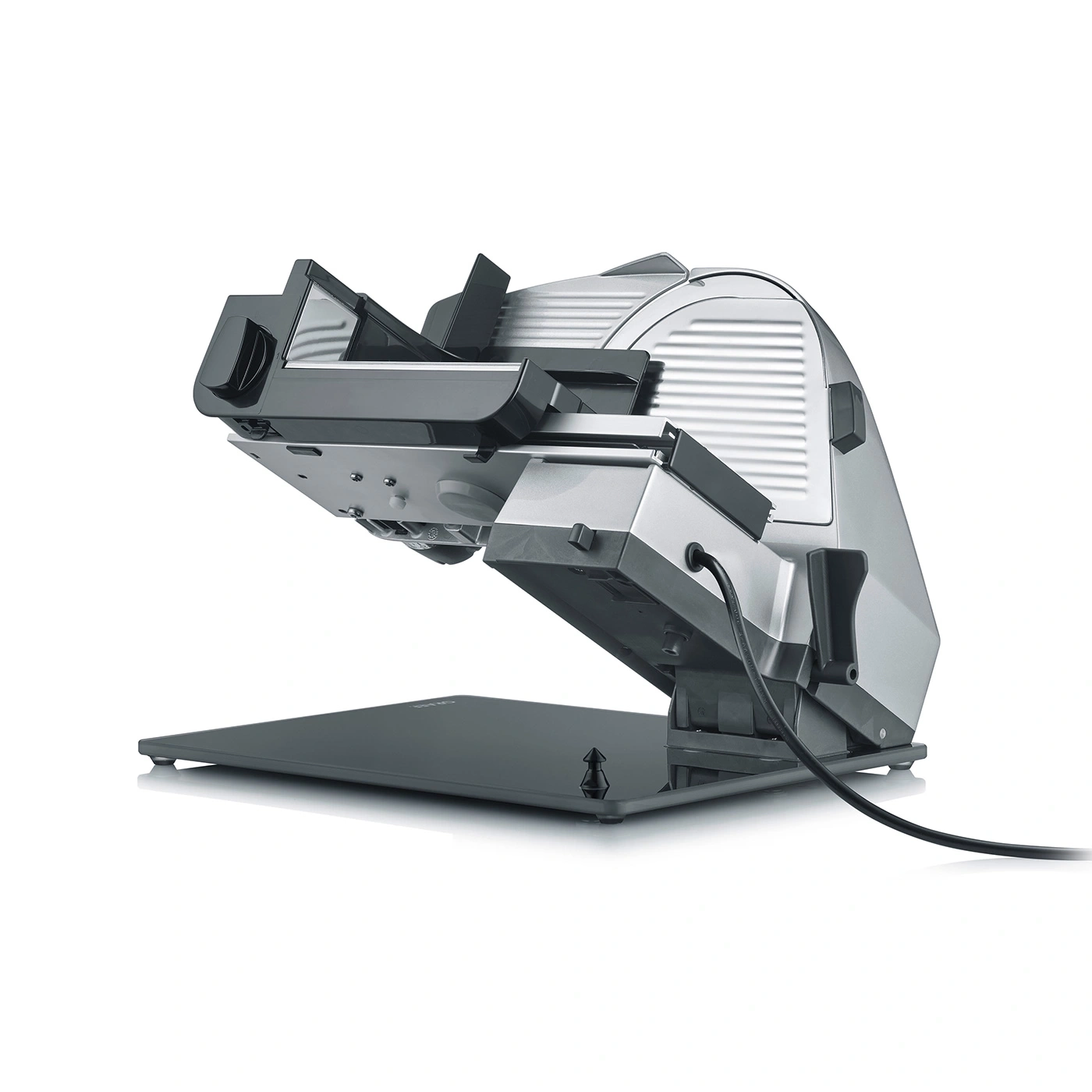 Electric food slicer, gray and black, angled on a white background.