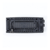 Top view of a black electronic device with holes and buttons.