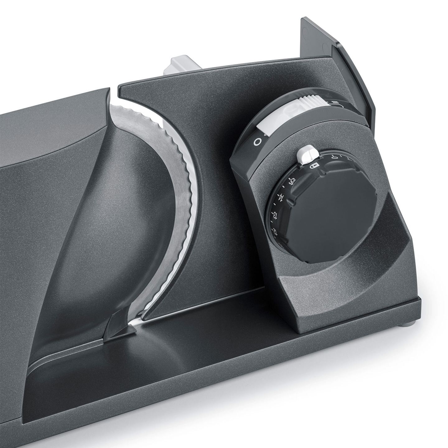 Gray electric food slicer with adjustment dial and blade for slicing food.