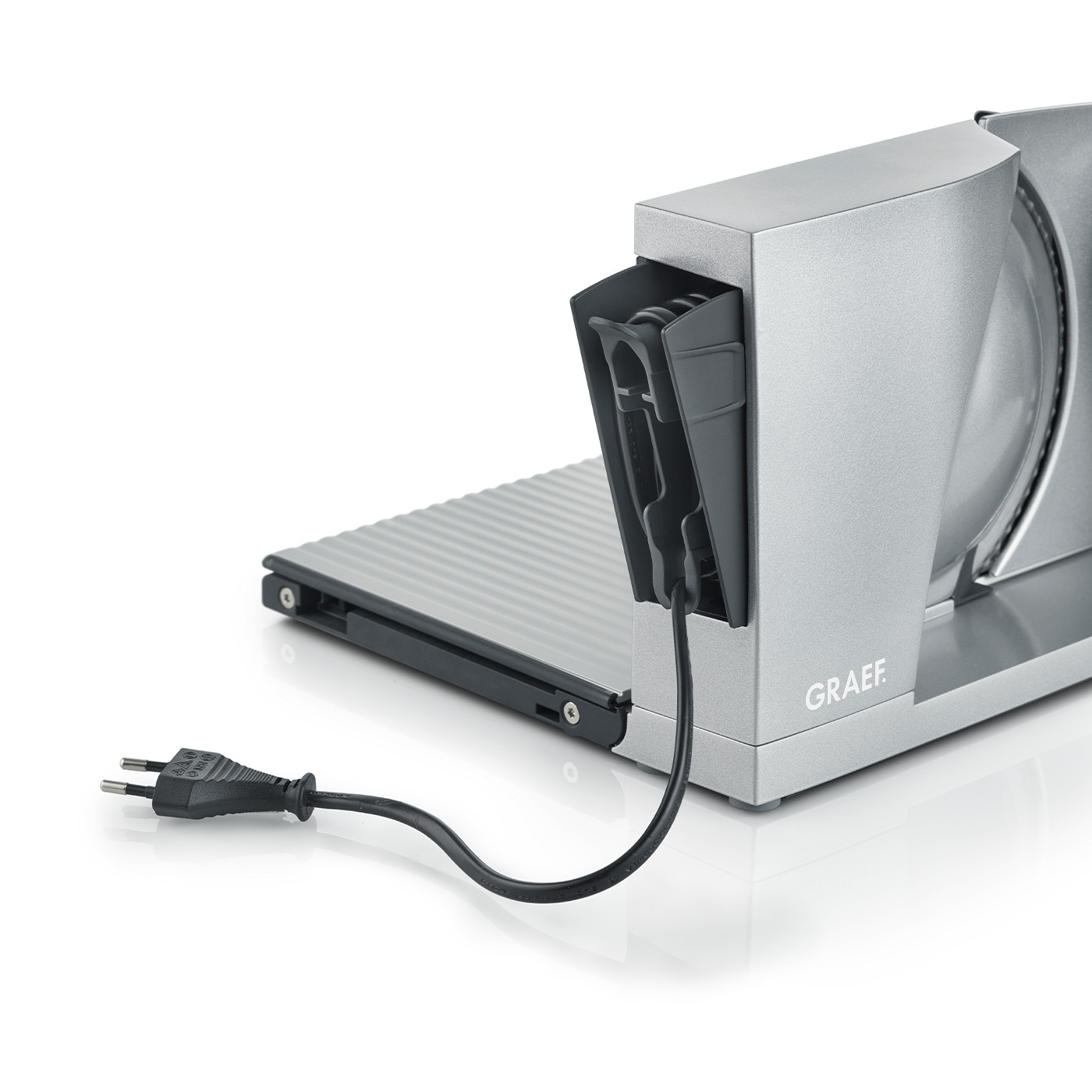 Graef slicer with power cord and plug on a white background, close-up