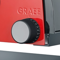 A red Graef slicer with a setting knob