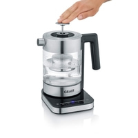 Kettle with hand opening the lid, GRAEF logo, and temperature display on a black base.