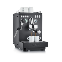 Black espresso machine with cups, coffee brewing, Graef logo, steam wand