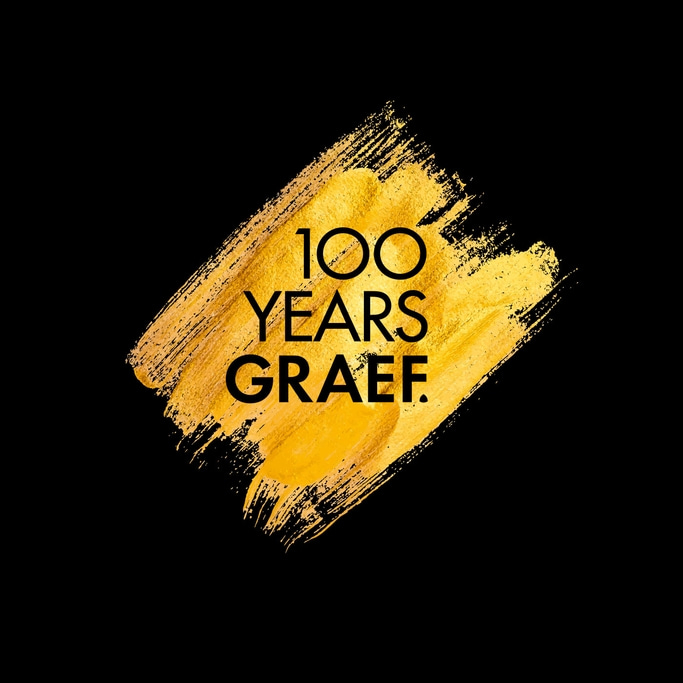 Golden brushstroke with text: 100 YEARS GRAEF on a black background.