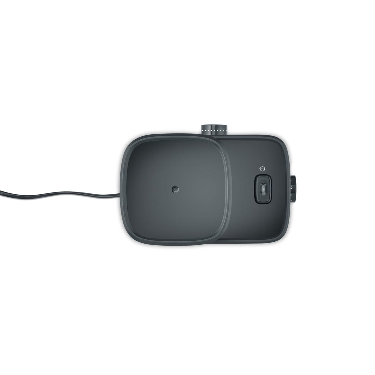 Appareil gris foncé avec boutons et câble sur fond blanc.