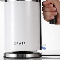 White kettle with handle and GRAEF logo on a white background, close-up.