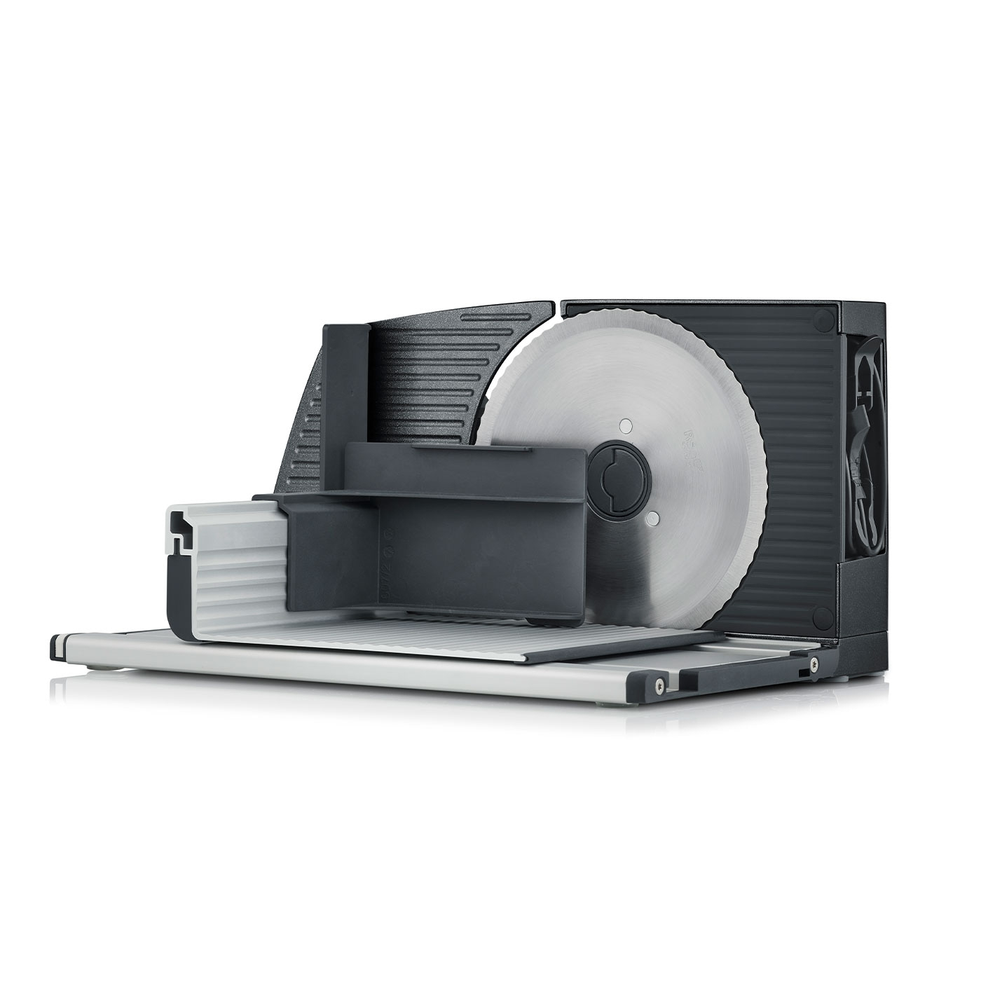 Electric food slicer with large circular blade and black housing on white background