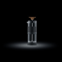 Coffee maker with wooden handle on black background, GRAEF logo