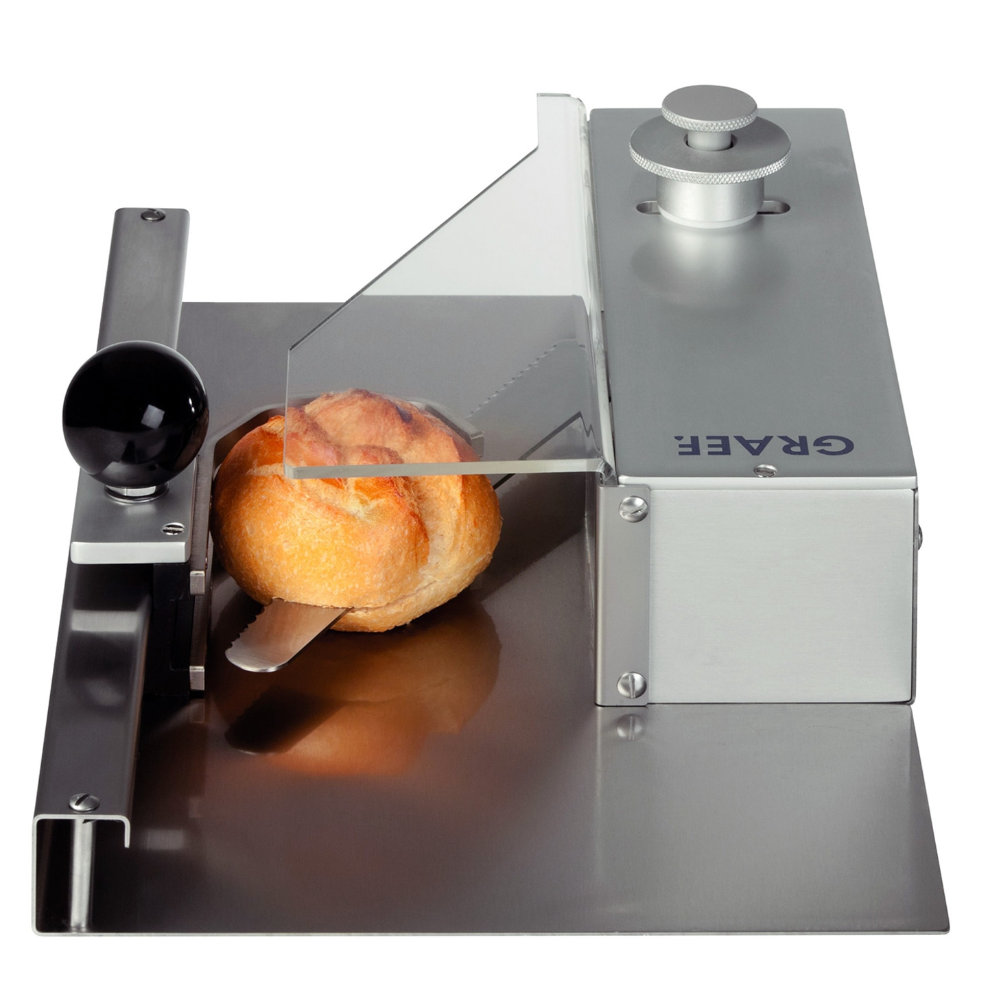 Bread machine with bread, knife and transparent shield made of metal